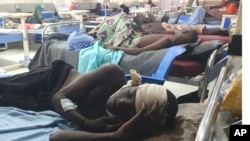 FILE - Injured victims of a suicide bomb attack receive treatment at a hospital in Maiduguri, Nigeria, June 30, 2024. At least 32 people were killed in three suicide bombings that same day; the attacks targeted a wedding, funeral, and hospital attending to the injured.