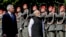 Indian Prime Minister Narendra Modi, right, is welcomed with military honors by Austria's Chancellor Karl Nehammer in Vienna, July 10, 2024.