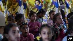 FILE - Children attend an activity at a makeshift class in Deir al Balah, Gaza Strip, April 21, 2024.