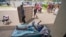 Thomas Leonard lies down at an evacuation center in Wailuku, Hawaii, after his Lahaina apartment burned down on Aug. 10, 2023. His daughter, Sherrie Esquivel of North Carolina, spent frantic days trying to find her father. Neighbors told her early Friday that he was safe.