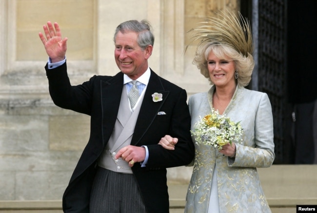 FILE - Britain's Prince Charles and The Duchess of Cornwall leave St. George's Chapel in Windsor Castle, southern England, following the Service of Prayer and Dedication following their marriage, Apr. 9, 2005.