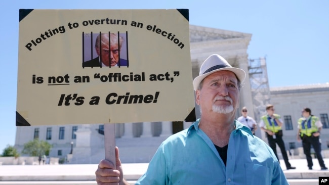 A man protests outside the Supreme Court, July 1, 2024, in Washington.