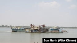 A ferry is shown on March 18, 2024, along the Mekong River where the proposed canal is planned.