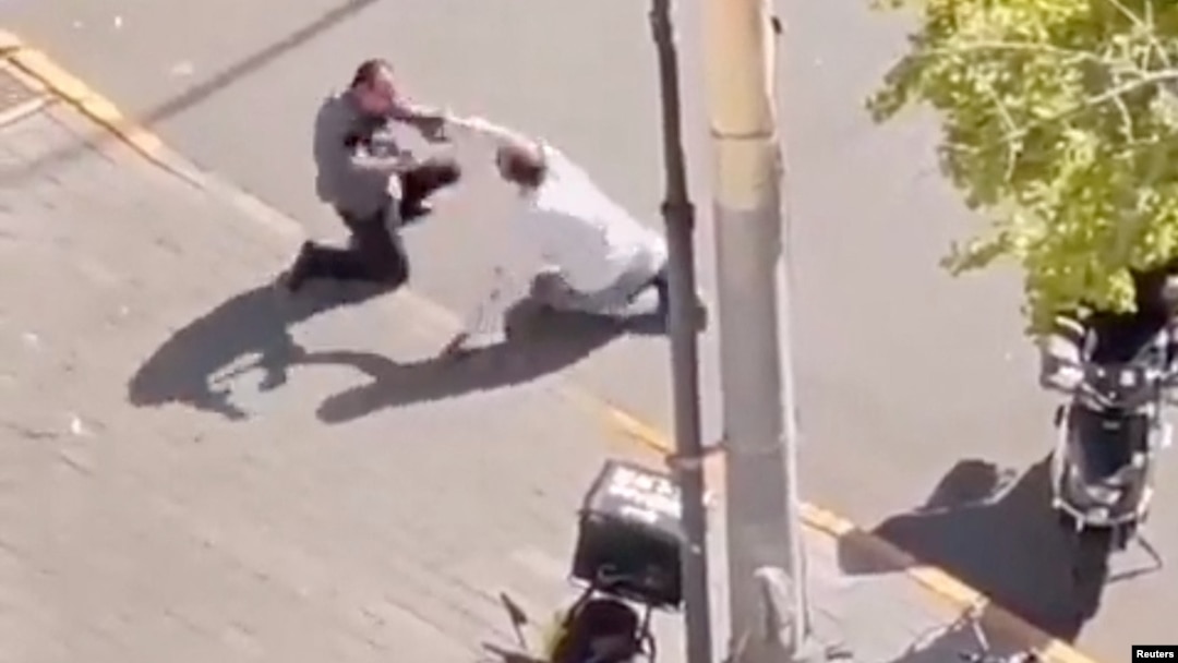 A screen grab obtained from a social media video shows the scene of the stabbing of an Israeli embassy staff member, in Beijing, China, Oct. 13, 2023. (Video obtained by Reuters)