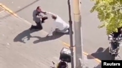 A screen grab obtained from a social media video shows the scene of the stabbing of an Israeli embassy staff member, in Beijing, China, Oct. 13, 2023. (Video obtained by Reuters)