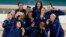 Members of the United States team pose for a picture with their gold medals at Bercy Arena at the 2024 Summer Olympics, in Paris, France, Aug. 11, 2024.