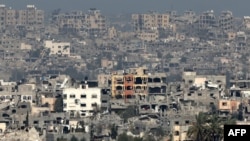 A picture taken from a position in southern Israel on March 6, 2024 shows destroyed buildings in the Gaza Strip.