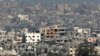 Bangunan-bangunan yang hancur di Jalur Gaza, di tengah pertempuran Israel dengan kelompok militan Palestina Hamas, diambil dari lokasi di Israel selatan, 6 Maret 2024 . (JACK GUEZ / AFP)