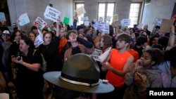 Protesters gather inside the Tennessee State Capitol to call for an end to gun violence and support stronger gun laws after a deadly shooting at the Covenant School in Nashville, Tennessee, March 30, 2023.