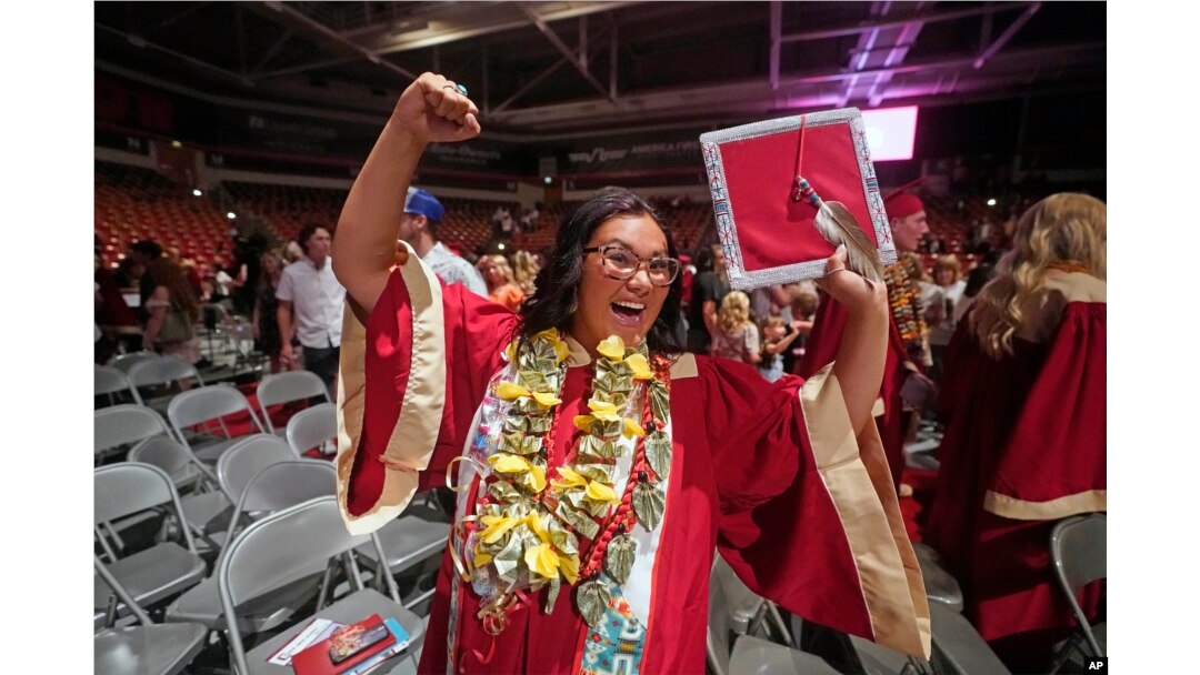 FILE - Amryn Tom reacts after graduating from Cedar City High School on Wednesday, May 25, 2022, in Cedar City, Utah.