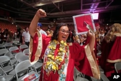 FILE - Amryn Tom reacts after graduating from Cedar City High School on Wednesday, May 25, 2022, in Cedar City, Utah.