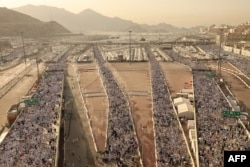 Muslim pilgrims arrive to perform the symbolic 'stoning of the devil' ritual as part of the hajj pilgrimage in Mina, near Saudi Arabia's holy city of Mecca, June 16, 2024.