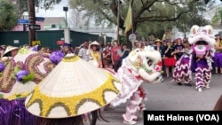 Members of Krewe of Mung Beans perform traditional dance during the Krewe of Dead Beans parade in New Orleans on Feb. 20. It is the inaugural parade of the Krewe of Mung Beans, the first Carnival season group with membership that is predominantly Vietnamese-American. 