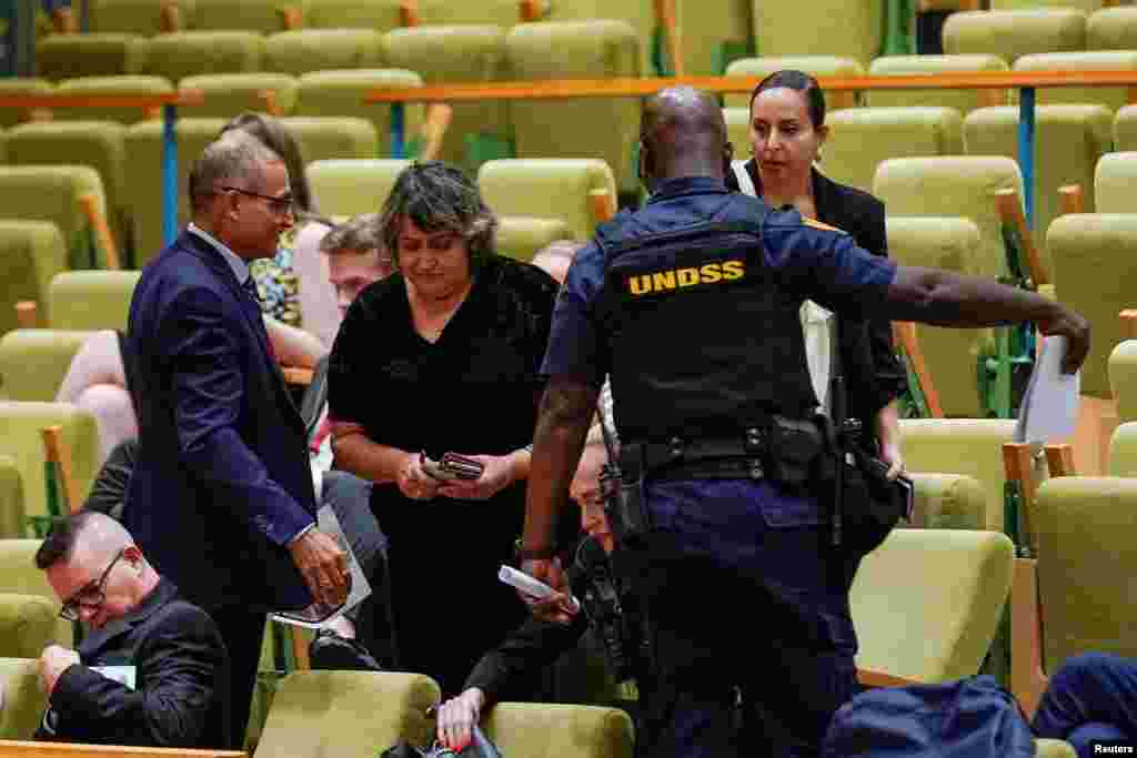 People protest for the release of the Israel citizens kidnapped by Hamas during a meeting of the United Nations Security Council at the United Nations Headquarters in New York City. REUTERS/Eduardo Munoz