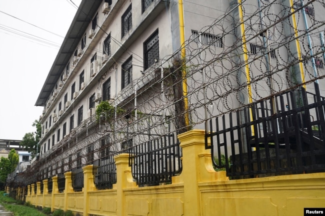FILE - Barbed wire fences are seen outside a Great Wall Park compound where Cambodian authorities said they had recovered evidence of human trafficking, kidnapping and torture during raids on suspected cybercrime compounds in the coastal city of Sihanoukville, September 21, 2022.