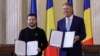 FILE - Ukrainian President Volodymyr Zelenskyy is pictured with Romania's President Klaus Iohannis following the signing of a strategic partnership in Bucharest, Oct. 10, 2023. (Inquam Photos/Octav Ganea via Reuters)