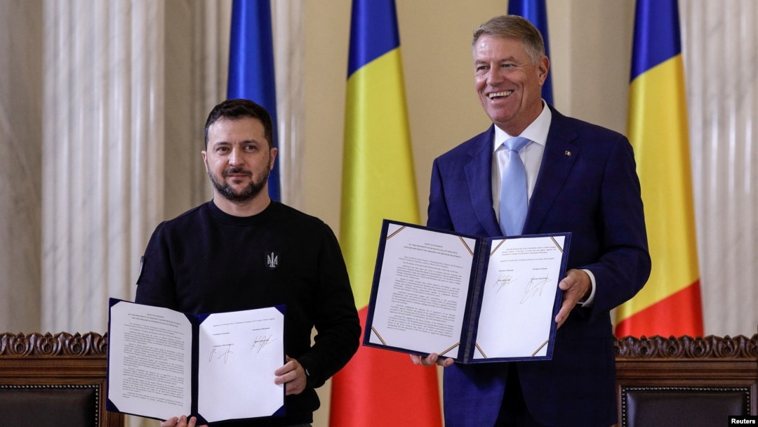FILE - Ukrainian President Volodymyr Zelenskyy is pictured with Romania's President Klaus Iohannis following the signing of a strategic partnership in Bucharest, Oct. 10, 2023. (Inquam Photos/Octav Ganea via Reuters)
