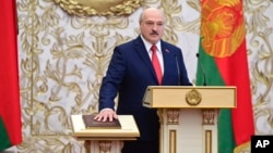 FILE - Belarusian President Alexander Lukashenko takes the oath of office at his inauguration ceremony at the Palace of the Independence in Minsk, Belarus, on Sept. 23, 2020.