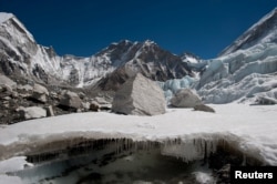 Water forms beneath the Khumbu glacier in Nepal as the ice melts.  (Photo: Alex Treadway/ICIMOD via REUTERS)