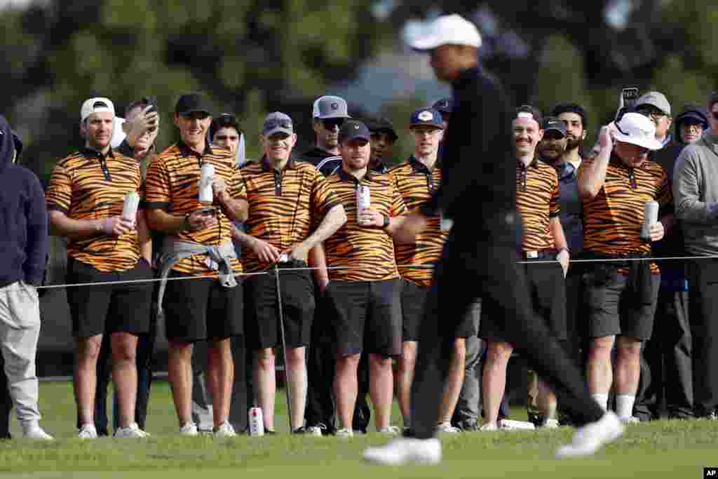 The gallery watches Tiger Woods walk by on the 11th fairway during the second round of the Genesis Invitational golf tournament at Riviera Country Club in the Pacific Palisades area of Los Angeles.