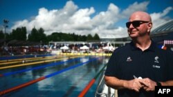 FILE - Swimming coach Bob Bowman gives a press conference during a France swimming team's training session in the Aquatic Stadium's pool in Bellerive-sur-Allier near Vichy, July 17, 2024. More and more international swimmers are being trained in the U.S. by coaches like Bowman.