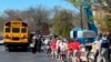 FILE - Students are taken to a reunification site after a deadly shooting at their school in Nashville, Tennessee, March 27, 2023. The United States is setting a record pace for mass killings in 2023, with an average of one every 6.53 days, according to a data analysis.
