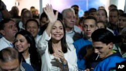 Opposition presidential hopeful Maria Corina Machado celebrates with supporters after listening to the results naming her winner of the opposition primary election, at her campaign headquarters in Caracas, Venezuela, early Monday, Oct. 23, 2023. 