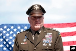 Army Gen. Mark Milley, chairman of the Joint Chiefs of Staff, attends an interview with the Associated Press at the American Cemetery of Colleville-sur-Mer, overlooking Omaha Beach, June, 6, 2022.
