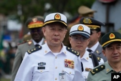 Unidentified Chinese naval officers attend Armed Forces Day in Richards Bay, South Africa, Feb. 21, 2023. The parade took place as a naval exercise was underway off the east coast of the country with Russian and Chinese navies.