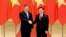 FILE - Chinese President Xi Jinping, left, and Vietnamese Chairman of the National Assembly Vuong Dinh Hue pose for a photo at the national assembly in Hanoi, Vietnam, Dec. 13, 2023.