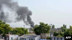 Smoke rises following an explosion after suicide squad allegedly attempted to storm an army cantonment that houses military residences and offices in Bannu on July 15, 2024.