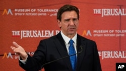Florida Governor Ron DeSantis talks to the media at a conference titled "Celebrate the Faces of Israel" at Jerusalem's Museum of Tolerance, April 27, 2023. While on the overseas trade mission in Israel this week, he said this of Disney: "The days of putting one company on a pedestal with no accountability are over in the state of Florida."