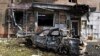 A burned car is seen in front of an apartment building damaged after shelling by the Ukrainian side in Kursk, Russia, Aug. 11, 2024. 