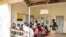 Barbara Nabulo talks to patients at the children's emergency ward at Mbale Regional Referral Hospital in Mbale, Uganda, April 26, 2024. 