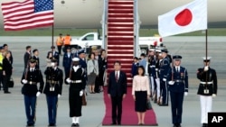Japan's Prime Minister Fumio Kishida, center left, and his wife, Yuko Kishida, center right, participate in an arrival ceremony at Andrews Air Force Base, Maryland, April 8, 2024. 