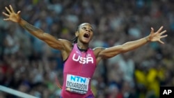 FILE - Sha'Carri Richardson, of the United States, celebrates after winning the gold medal in the final of the Women's 100-meters during the World Athletics Championships in Budapest, Hungary, Aug. 21, 2023.