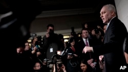 Majority Leader Steve Scalise, right, speaks to reporters after a closed-door meeting of House Republicans during which he was nominated as their candidate for Speaker of the House, Oct. 11, 2023 in Washington.