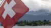 A Swiss flag is pictured in front of the Burgenstock Resort where the Summit on Peace in Ukraine will take place June 15 and 16, in Lucerne, Switzerland, May 28, 2024. 