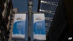 Banners for the upcoming BRICS, Brazil, Russia, India, China, and South Africa  summit hang from a pole outside the Sandton Convention Centre in Johannesburg, South Africa, Aug. 19, 2023. 