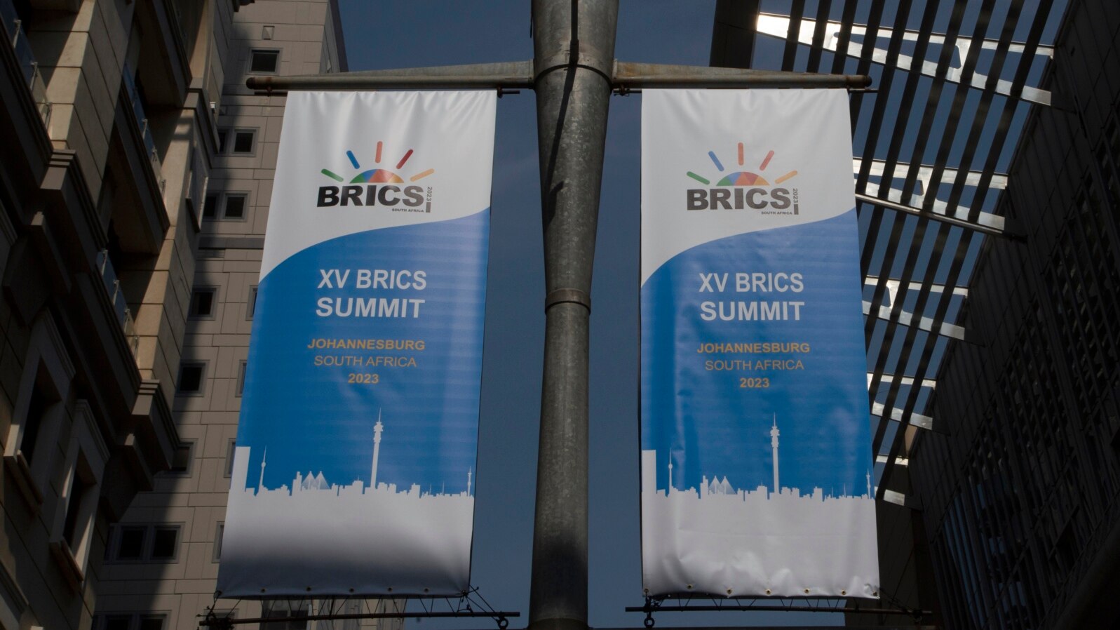 FILE - Banners promoting a BRICS summit hang from a pole outside the Sandton Convention Centre in Johannesburg, South Africa, Aug. 19, 2023. 