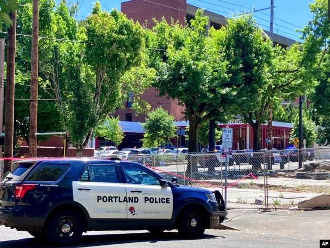 FILE - Portland Police respond to a shooting at the Legacy Good Samaritan Medical Center in Portland, Ore., July 22, 2023. Shootings and other attacks are increasing at hospitals across the U.S., helping to make health care one of the nation's most violent fields. (Maxine Bernstein/The Oregonian via AP, File) Keep aspect ratio