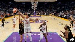 Phoenix Mercury center Brittney Griner (42) blocks a shot by Los Angeles Sparks guard Dearica Hamby (5) during the second half of a WNBA basketball game in Los Angeles, May 19, 2023.