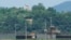 A North Korean military guard post, top, and South Korean post, bottom, are seen from Paju, South Korea, near the border with North Korea, May 31, 2024. 
