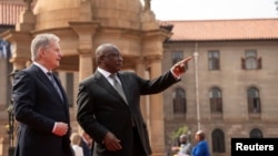 South African President Cyril Ramaphosa, right, talks with Finland's President Sauli Niinisto during the welcoming ceremony for the official state visit at the Union Buildings in Pretoria, South Africa, April 25, 2023.