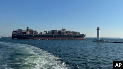 FILE - A container ship leaves the port of Odesa, Ukraine, on Aug. 16, 2023, to proceed through a temporary corridor established for merchant vessels.