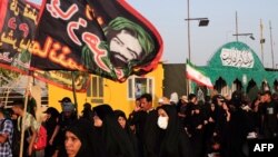 Shiite pilgrims arrive in the central Iraqi shrine city of Karbala on Sept. 1, 2023, to take part in the Arbaeen religious festival.