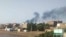 Smoke rises over Khartoum, Sudan, June 23, 2023. Clashes between warring factions resumed in Sudan's capital and a neighboring city after a three-day cease-fire expired.