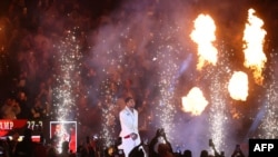 British boxer Anthony Joshua (C) celebrates after defeating Cameroonian-French boxer Francis Ngannou during their heavyweight boxing match in Riyadh's Kingdom Arena indoor stadium, on March 9, 2024.