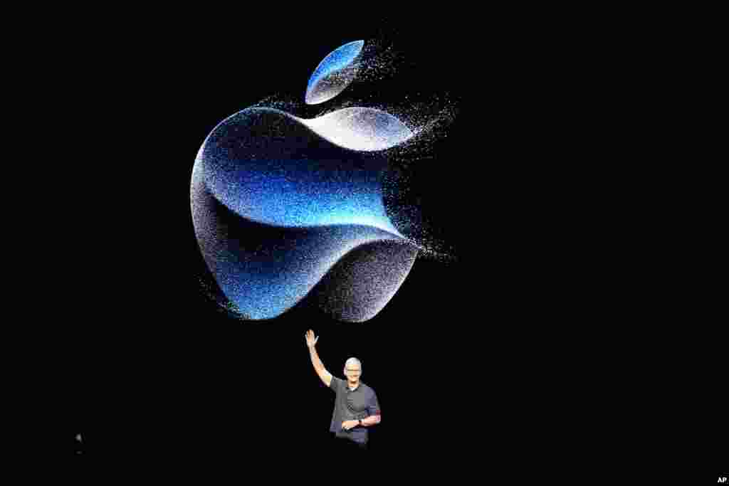 Apple CEO Tim Cook waves as he walks to the stage during an announcement of new products on the Apple campus in Cupertino, California.