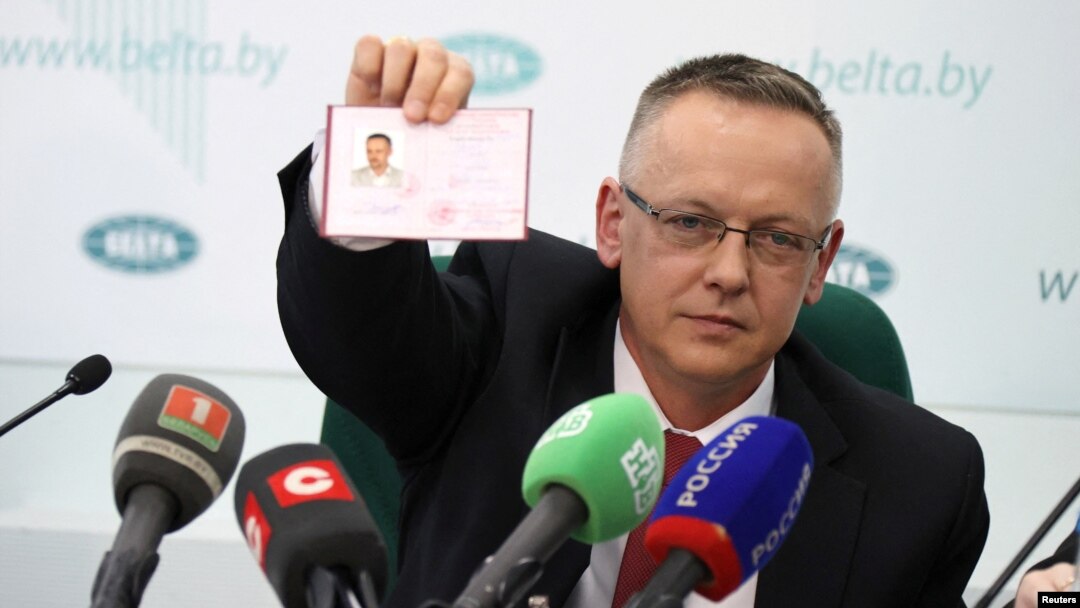 Tomasz Szmydt, a Polish judge who requested political asylum in Belarus, shows his ID document during a press conference in Minsk, Belarus, May 6, 2024. (BelTA/Maxim Guchek/Handout via Reuters)